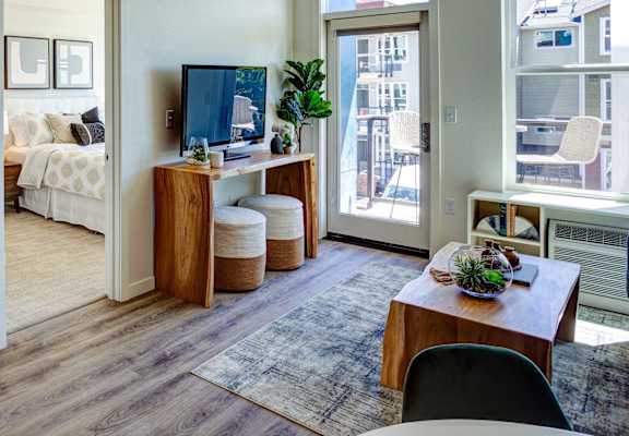 Bedroom and living at Commons at Sylvan Canyon Apartments, Oregon