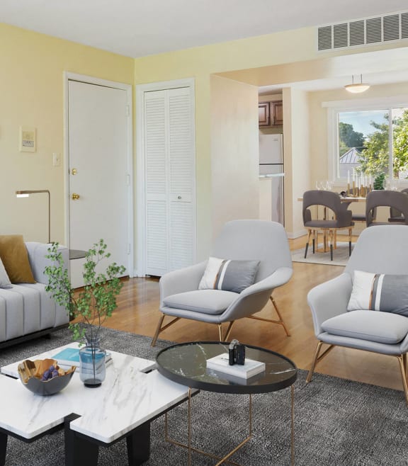 a living room with couches and chairs and a coffee table