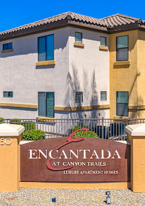 a view of the sign at the entrance to the encantada saguaro national park